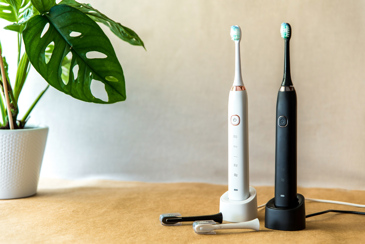 Modern black and white sonic or electric whitening toothbrush se